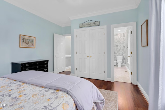 4027 Green Forest Ct, Rocky Mount, NC 27804 - bedroom featuring connected bathroom, dark hardwood / wood-style floors, a closet, and crown molding