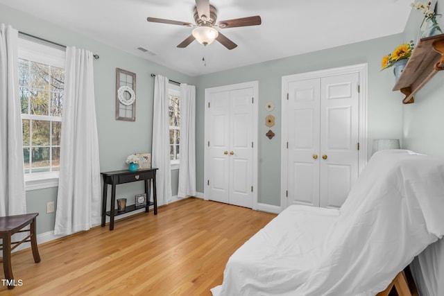 4027 Green Forest Ct, Rocky Mount, NC 27804 - living area with ceiling fan, a healthy amount of sunlight, and wood-type flooring