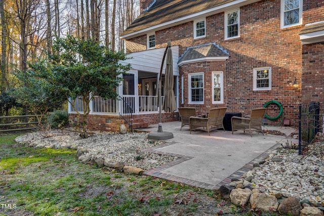 4027 Green Forest Ct, Rocky Mount, NC 27804 - rear view of property featuring a sunroom and a patio