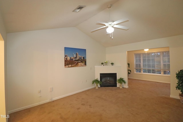 unfurnished living room with carpet, vaulted ceiling, and ceiling fan