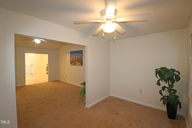 empty room featuring light carpet and ceiling fan