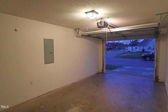 garage with electric panel and a garage door opener