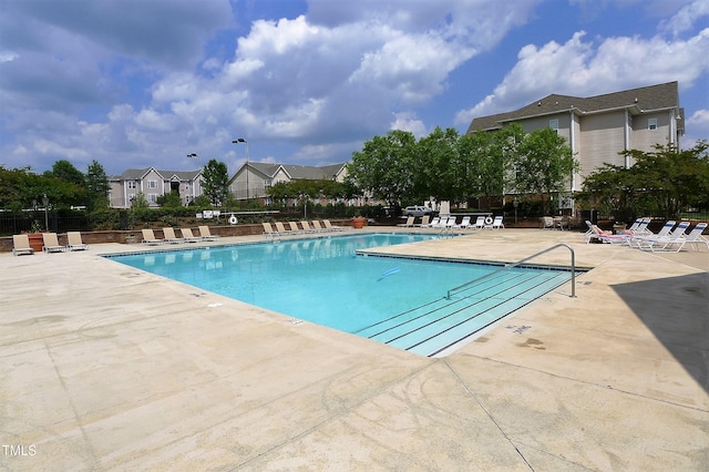 view of swimming pool featuring a patio area