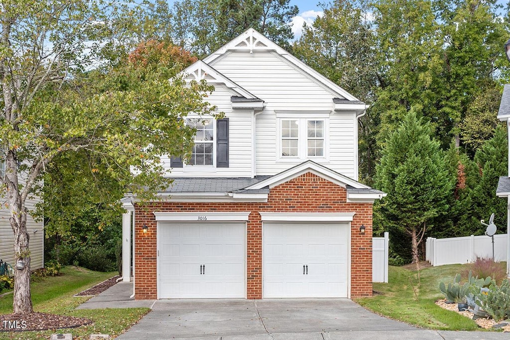 view of front facade featuring a front lawn and a garage