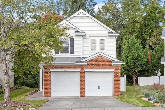 view of front facade featuring a front lawn and a garage