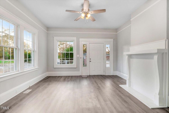 entryway with hardwood / wood-style floors and ceiling fan