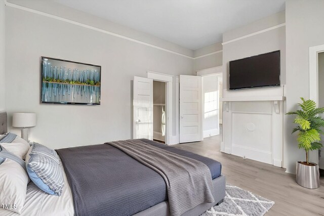 bedroom with hardwood / wood-style flooring