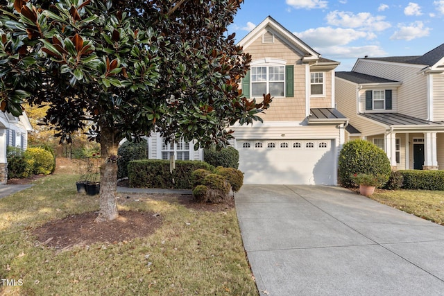 view of front facade featuring a garage and a front lawn