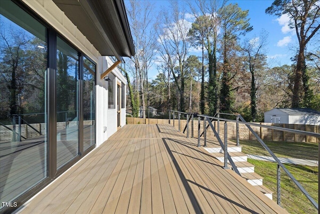 wooden terrace with a playground