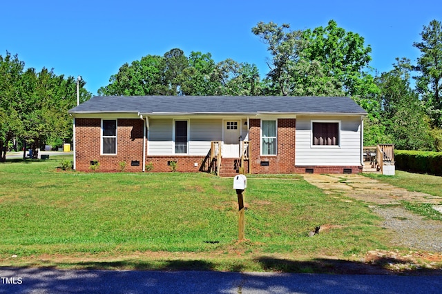 ranch-style home featuring a front lawn