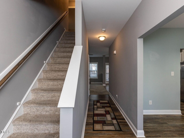 stairs with hardwood / wood-style flooring