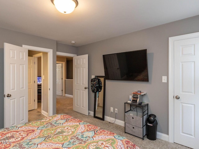 bedroom featuring light carpet