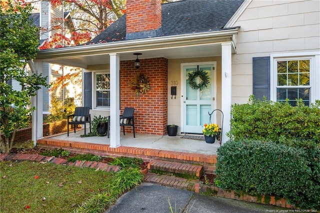 doorway to property with a porch