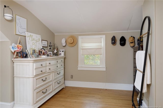 interior space with light hardwood / wood-style flooring and lofted ceiling