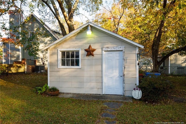 view of outdoor structure with a lawn