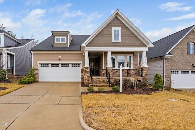 craftsman-style home featuring covered porch and a front yard