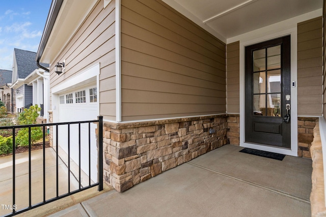 entrance to property featuring a garage