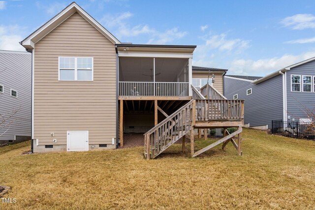 back of house featuring a sunroom and a yard