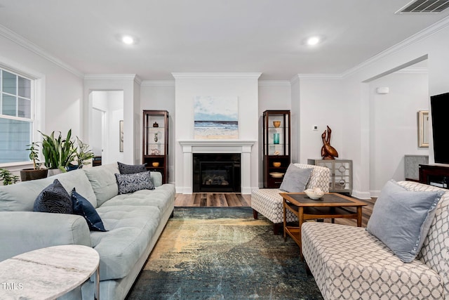 living room featuring crown molding and dark hardwood / wood-style floors