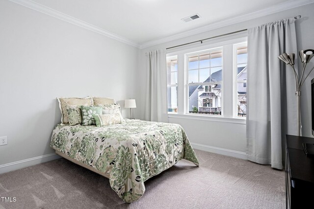 carpeted bedroom with crown molding