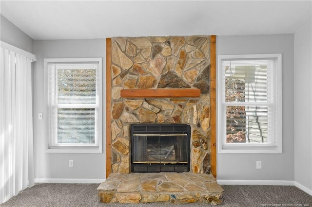 interior details with carpet flooring and a fireplace