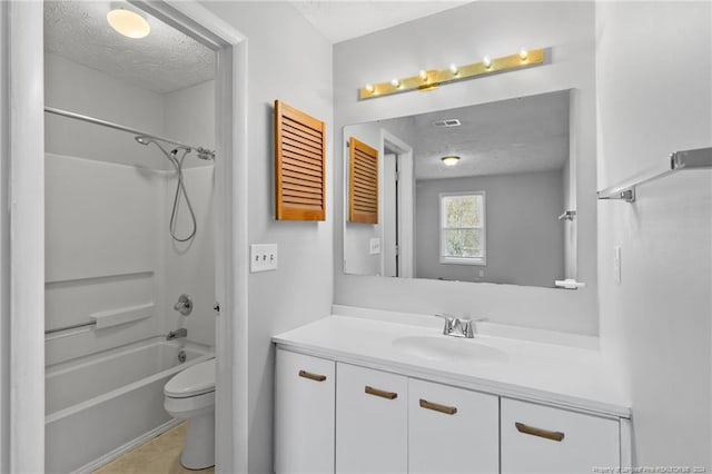 full bathroom with shower / bathing tub combination, vanity, toilet, and a textured ceiling