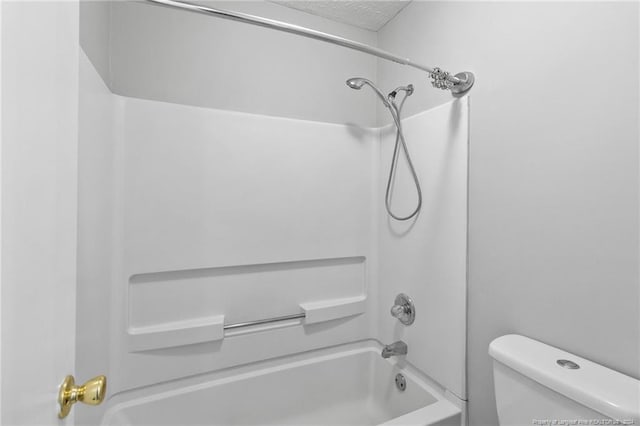 bathroom with toilet and shower / bathtub combination