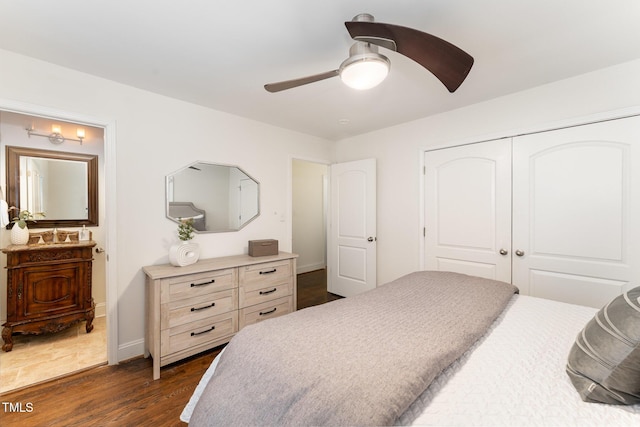 bedroom with dark hardwood / wood-style flooring, a closet, and ceiling fan