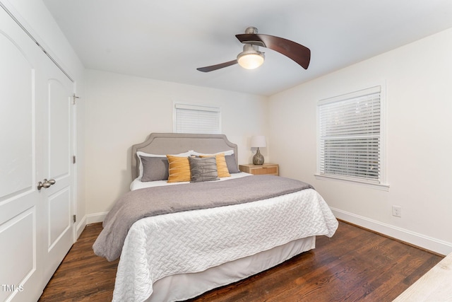 bedroom with a closet, ceiling fan, and dark hardwood / wood-style flooring