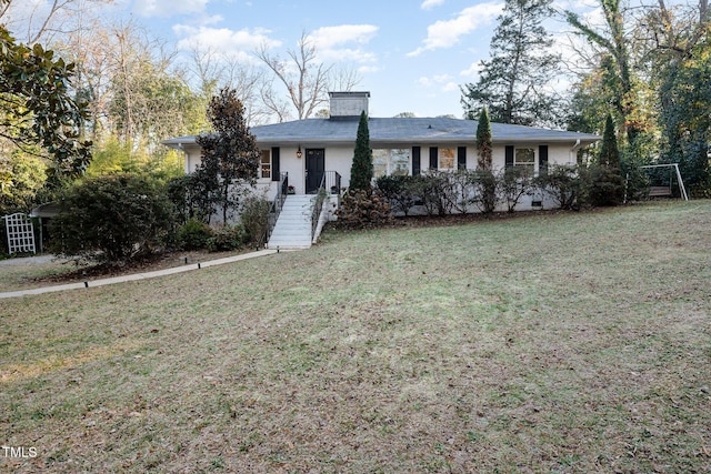 ranch-style home featuring a front yard