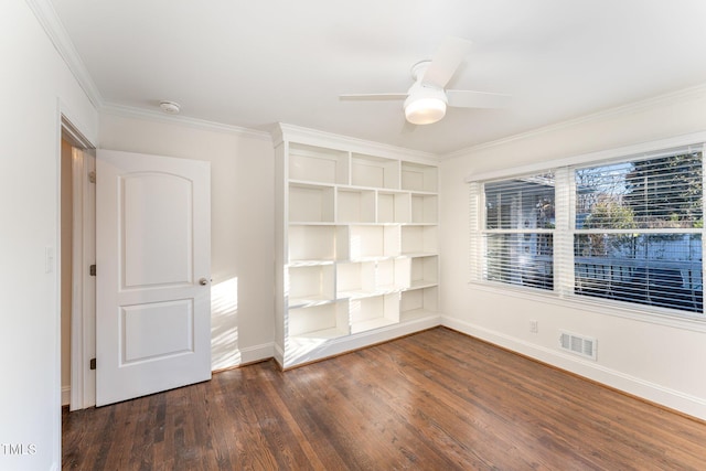 unfurnished room featuring ceiling fan, crown molding, and dark hardwood / wood-style floors