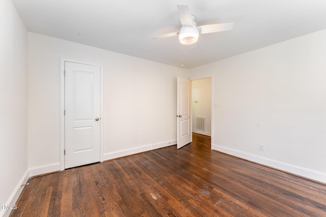 unfurnished room featuring ceiling fan and dark hardwood / wood-style floors