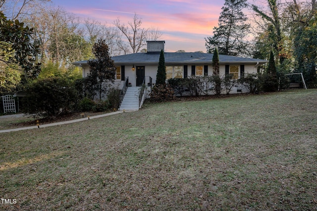 view of front of house with a lawn