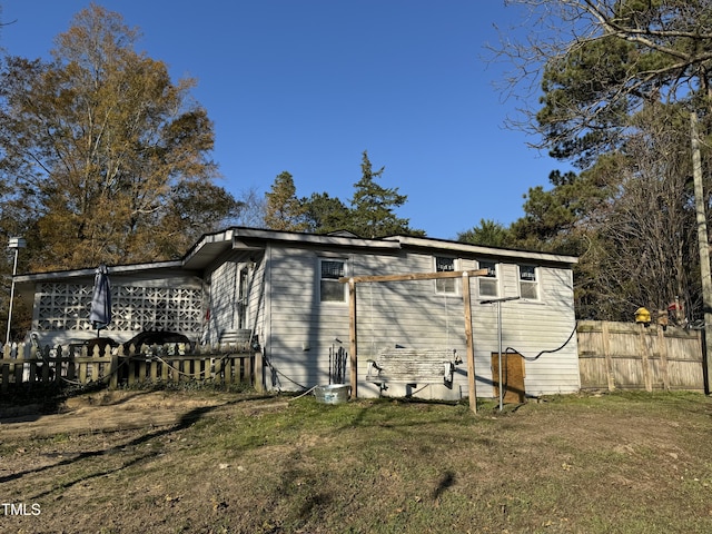 view of side of property with a yard