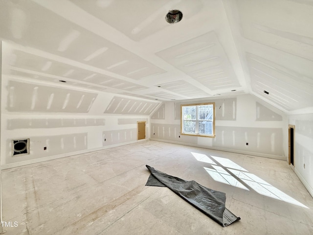 additional living space with vaulted ceiling