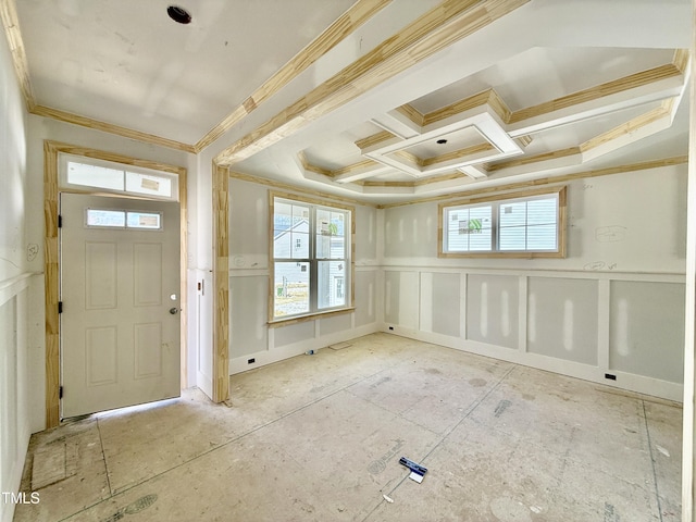 foyer with a healthy amount of sunlight, coffered ceiling, and a decorative wall