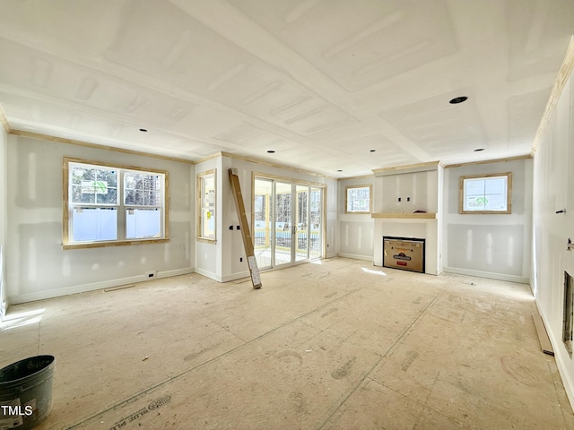 unfurnished living room with french doors, a fireplace, visible vents, and baseboards