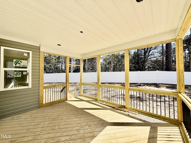 wooden terrace featuring a fenced backyard