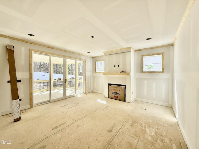 unfurnished living room with crown molding and french doors