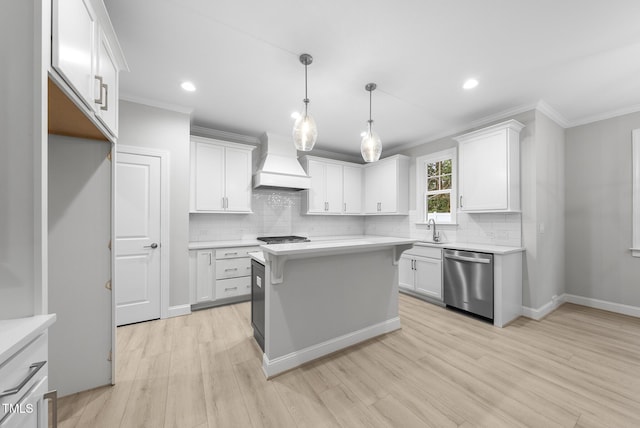 2625 Silver Gate Ct, Wake Forest, NC 27587 - kitchen featuring stainless steel appliances, custom range hood, crown molding, light countertops, and light wood-type flooring