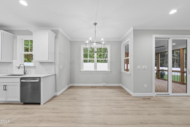 2625 Silver Gate Ct, Wake Forest, NC 27587 - kitchen featuring dishwasher, light wood-type flooring, a chandelier, light countertops, and white cabinetry