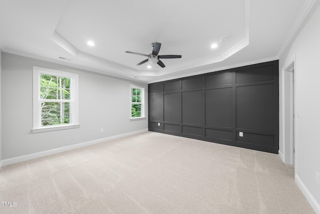 2625 Silver Gate Ct, Wake Forest, NC 27587 - unfurnished bedroom featuring a raised ceiling, crown molding, multiple windows, light carpet, and recessed lighting