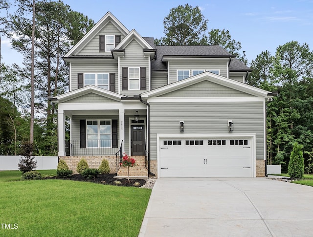 2625 Silver Gate Ct, Wake Forest, NC 27587 - view of front of house featuring a porch, concrete driveway, and a shingled roof