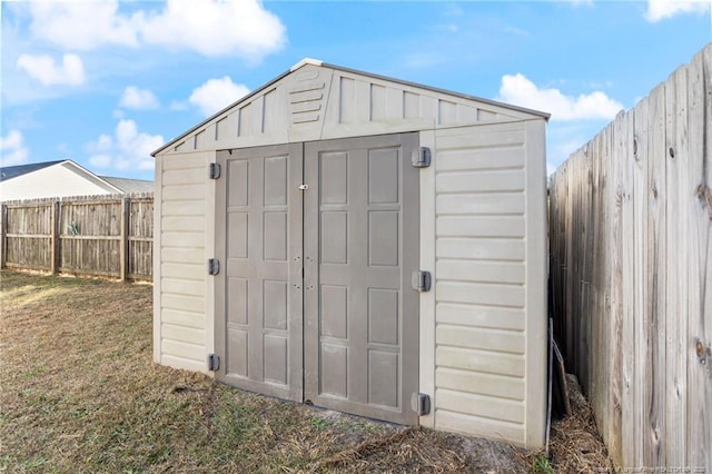 view of outbuilding with a yard