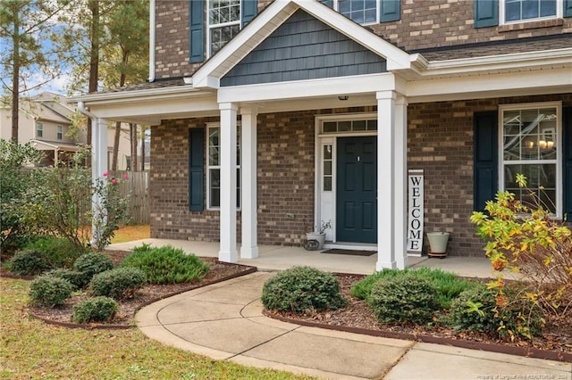 doorway to property featuring covered porch