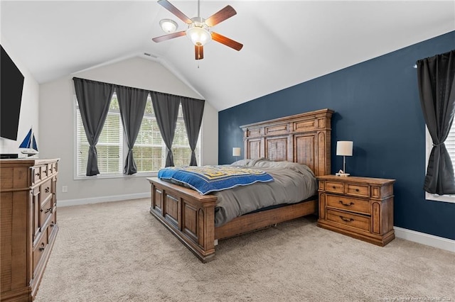 carpeted bedroom with vaulted ceiling and ceiling fan