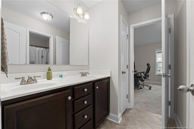 bathroom with tile patterned floors and vanity