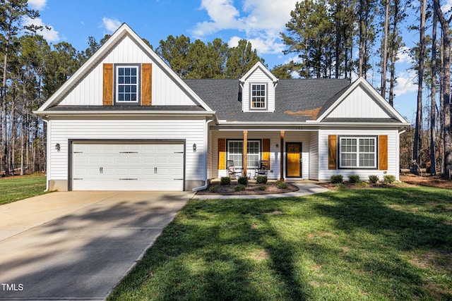 craftsman-style home featuring covered porch, a garage, and a front lawn