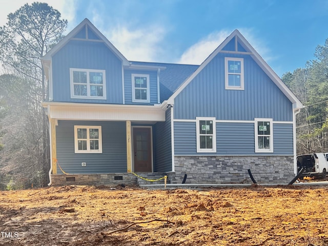 view of front of property featuring a porch, board and batten siding, and crawl space