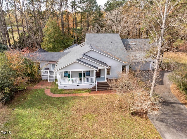 exterior space featuring a yard and covered porch